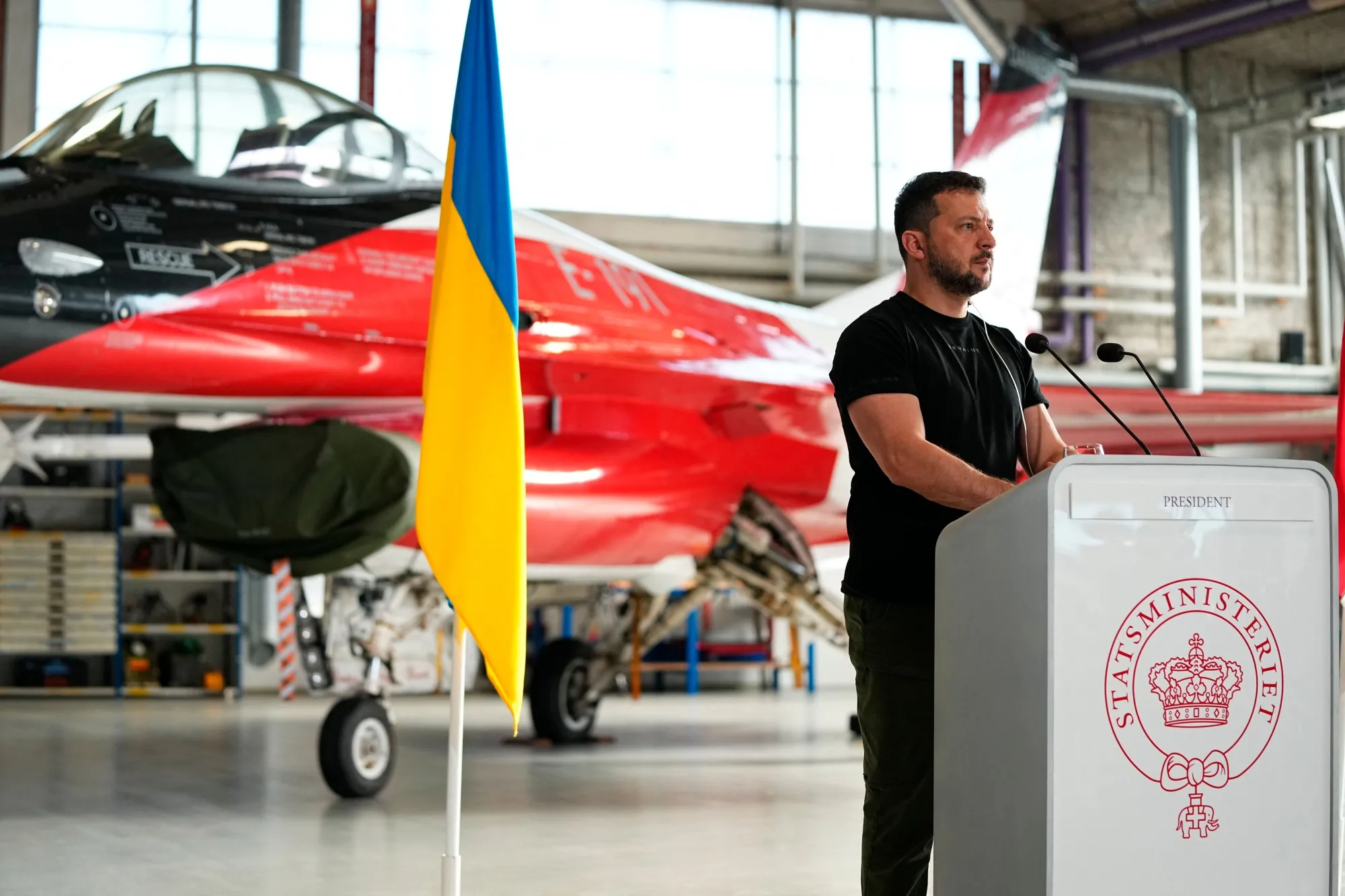 Volodymyr Zelensky in front of a F-16 fighter jet in the hangar of the Skrydstrup Airbase in Vojens, northern Denmark.