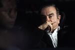 Carlos Ghosn, former chairman of Nissan Motor Co., sits in a vehicle as he leaves his lawyer's office in Tokyo, Japan, on Wednesday, March 6, 2018.