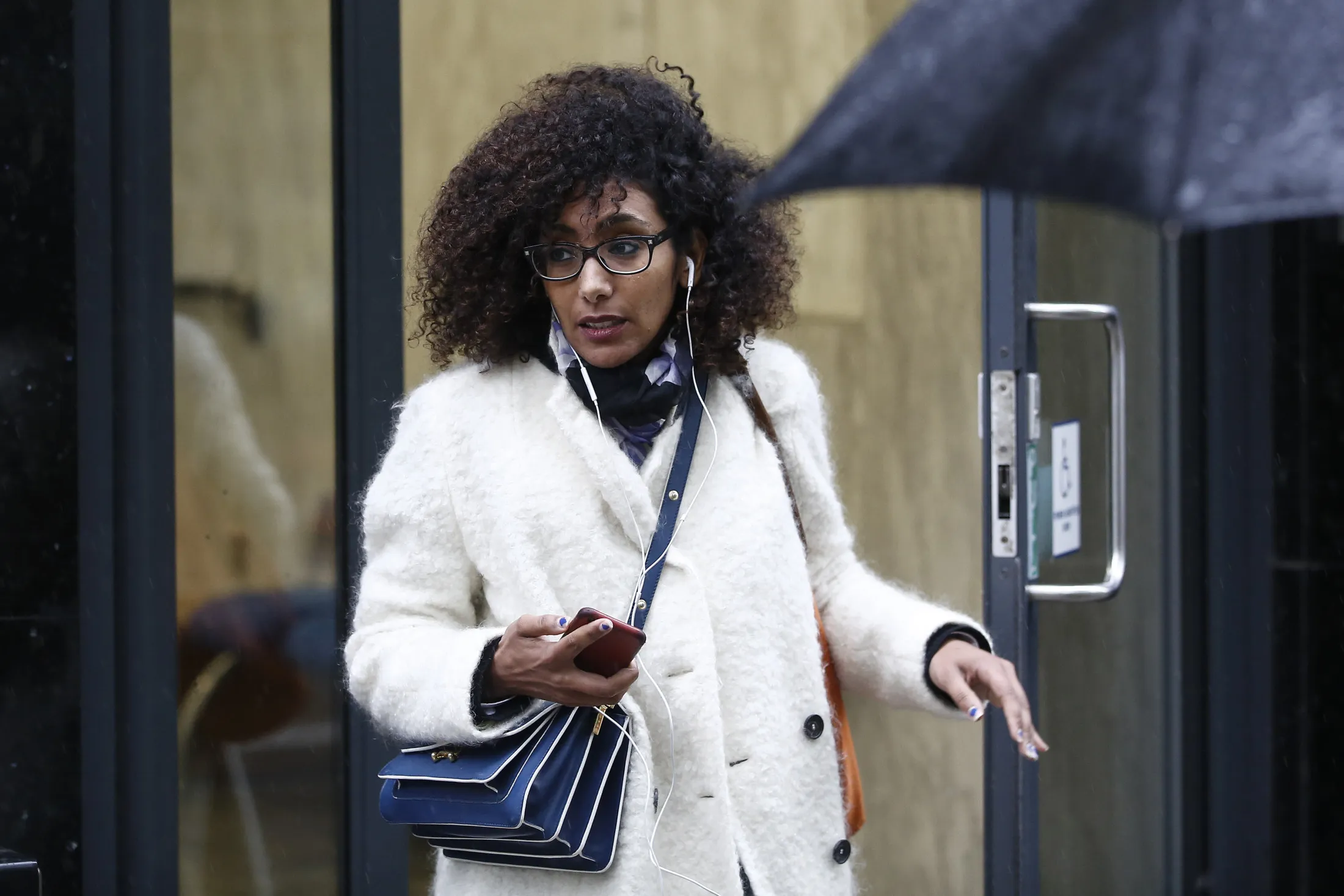 Dalal Alaoui Belghiti takes a break from her trial in London on Sept. 16, 2015.
