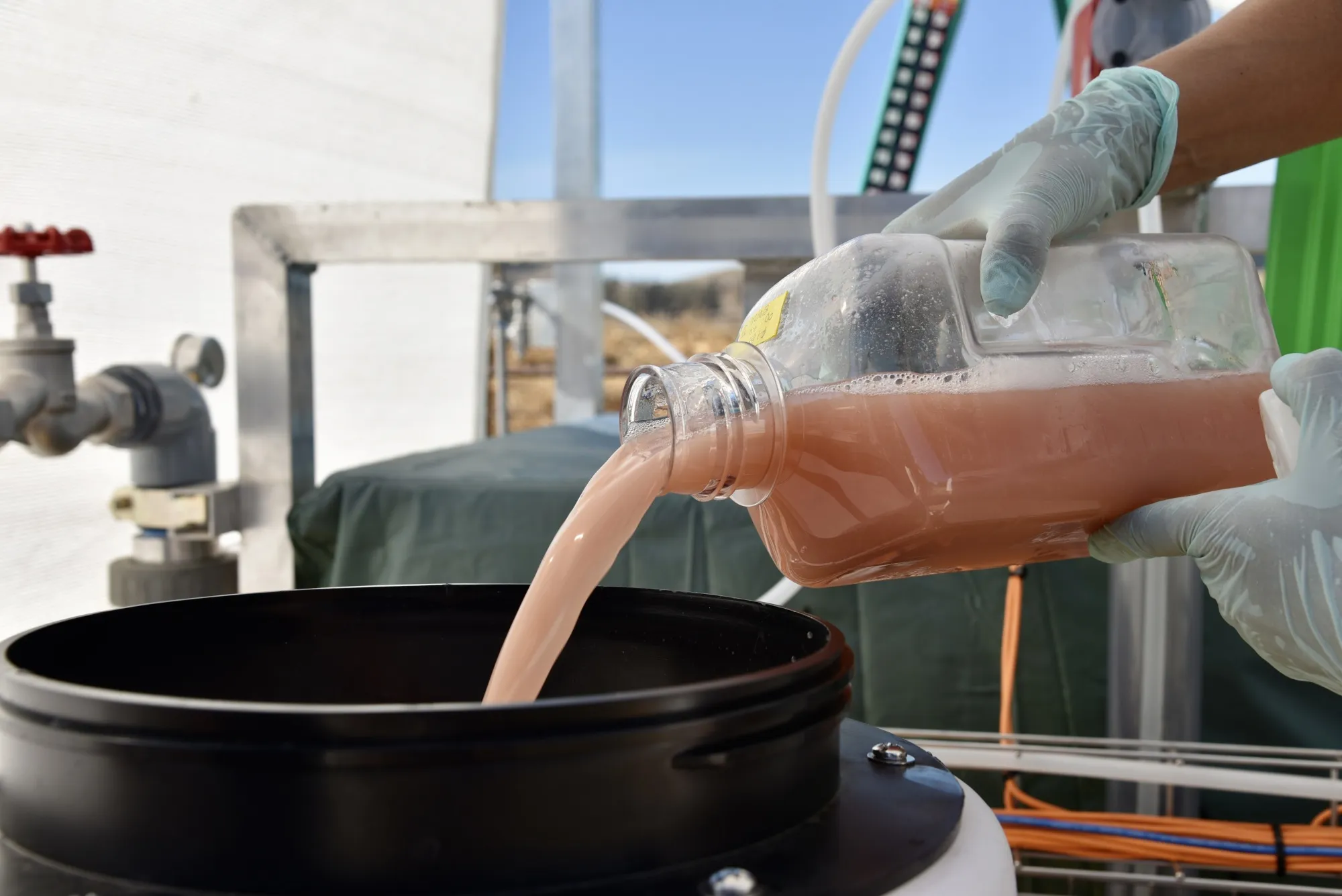 Mems being poured in preparation for use.