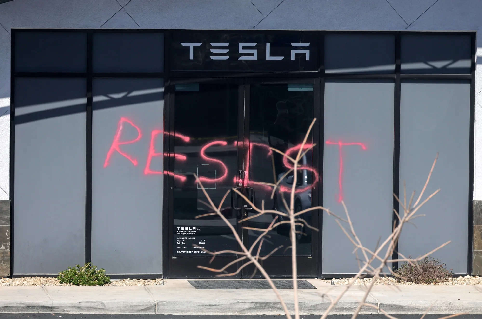 “RESIST” spray painted on the entrance of a Tesla Collision Center in Las Vegas, Nevada, on March 18.&nbsp;