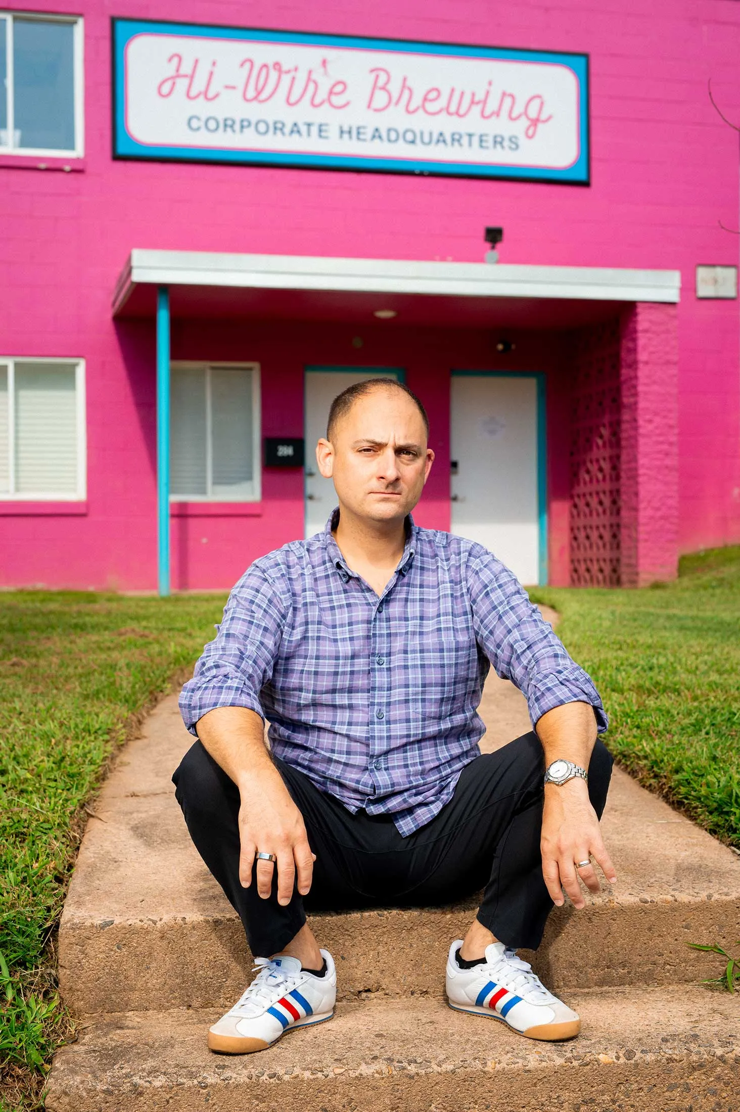 Hi-Wire Brewing co-owner Adam Charnack at the company’s rebuilt taproom and warehouse.