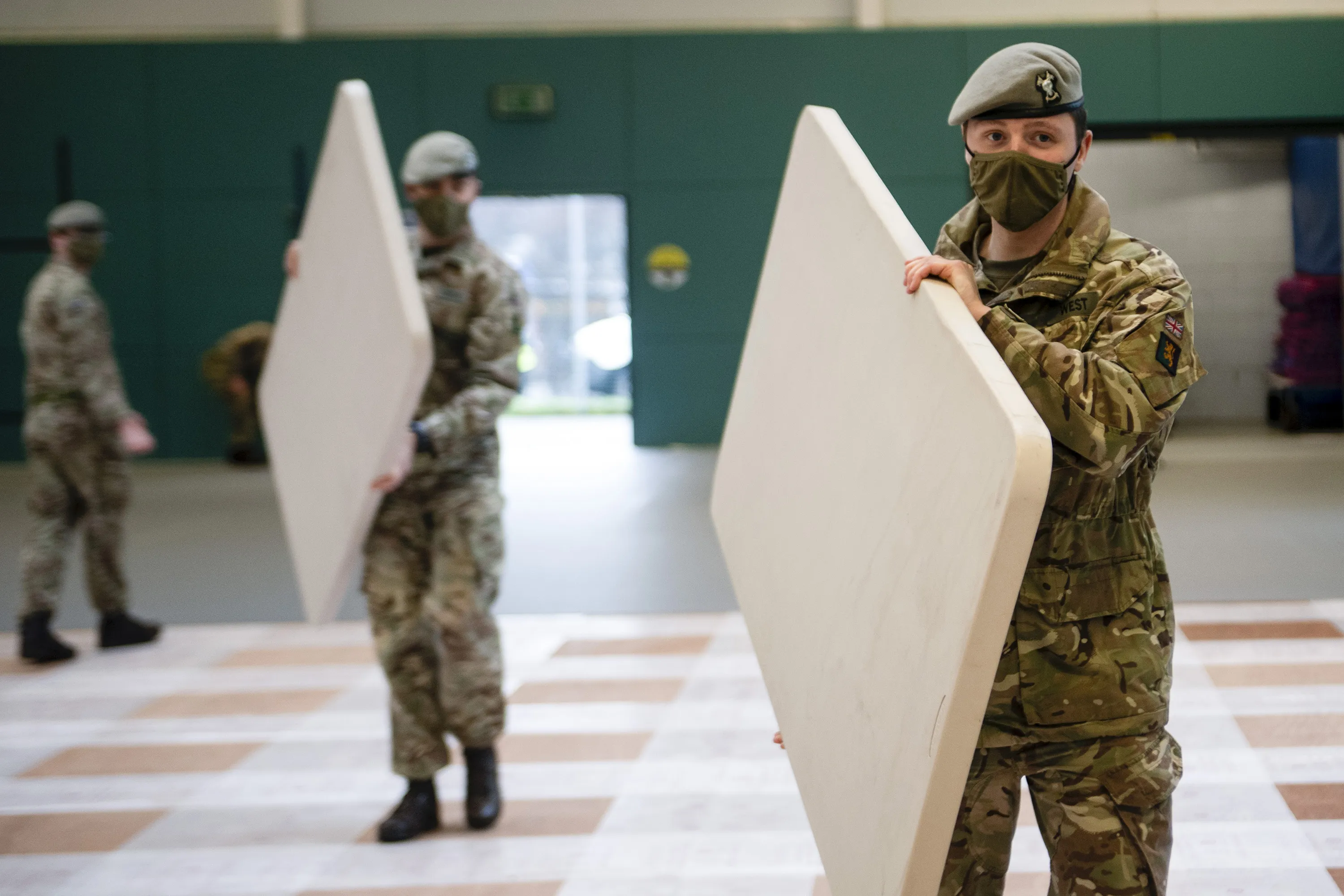 Members of the Royal Scots Dragoon Guards work to convert a sports hall into a Covid 19 vaccination center&nbsp;in Glasgow, on Jan. 20.