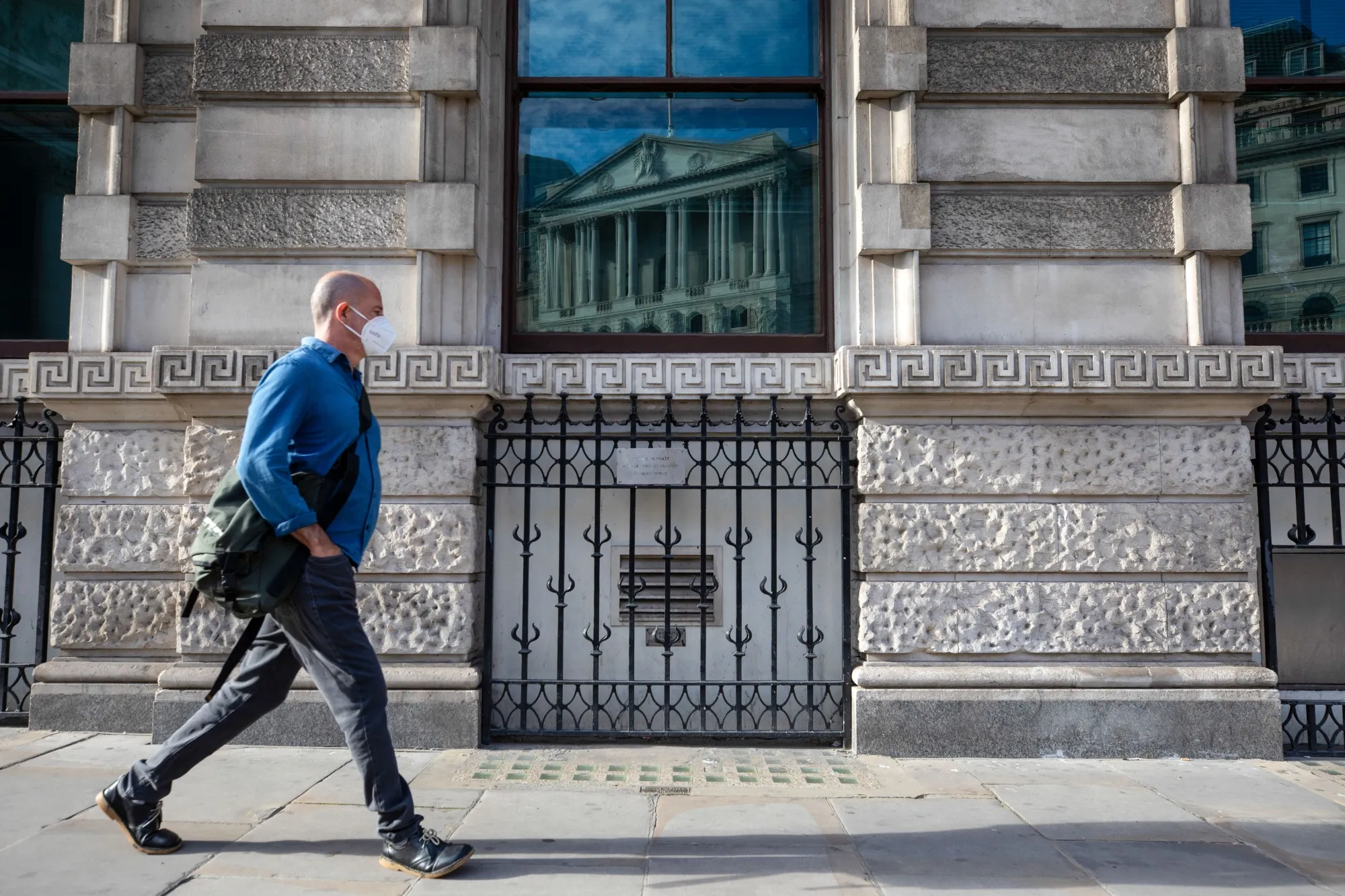 The Bank of England reflected in a window in the City of London.