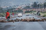 A barricade is seen in the road as members of the Economic Freedom Fighters (EFF) gather in Durban, South Africa,&nbsp;on March 20.