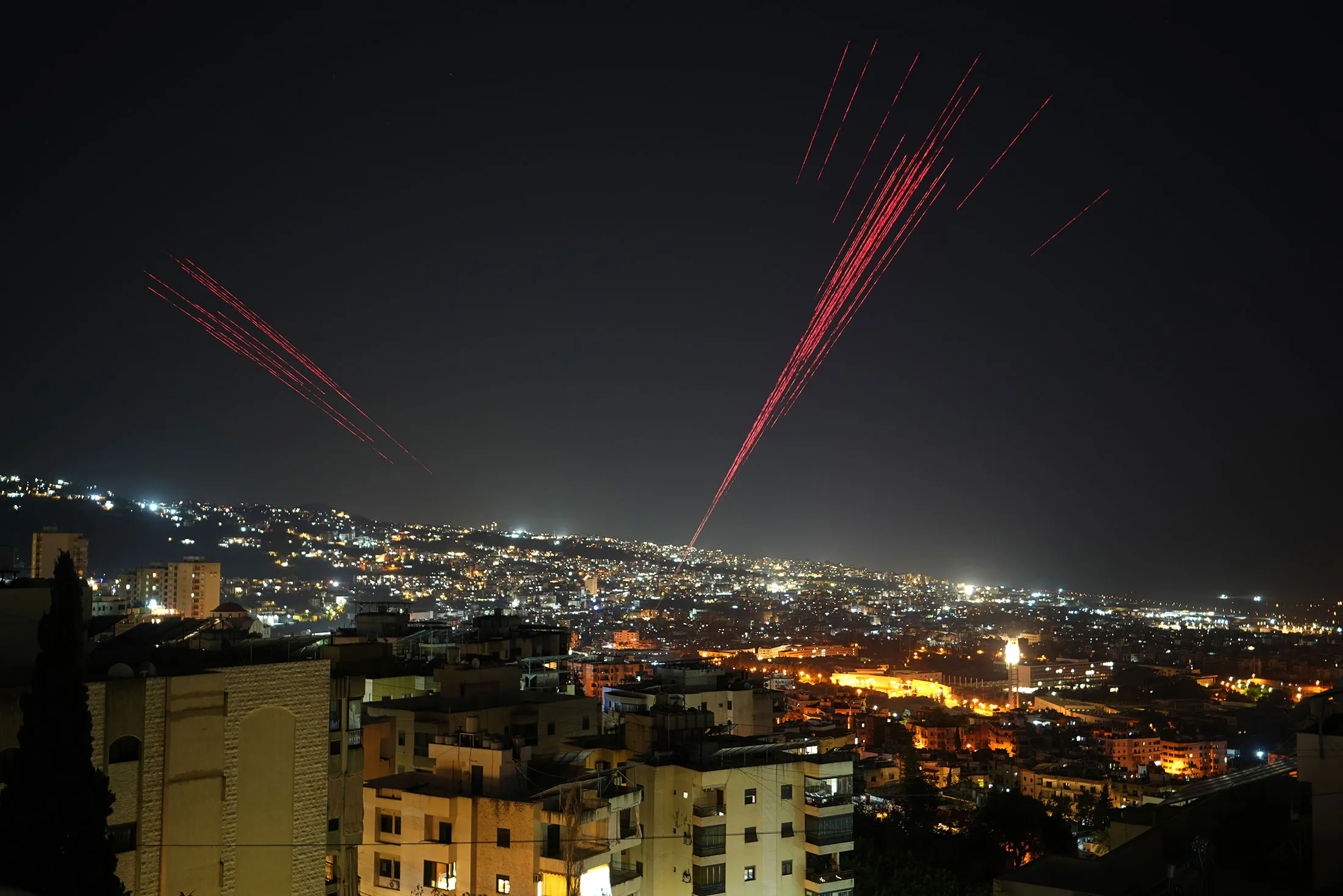 People fire live ammunition and fireworks following the ceasefire between Israel and Hezbollah in Beirut, on April 17.