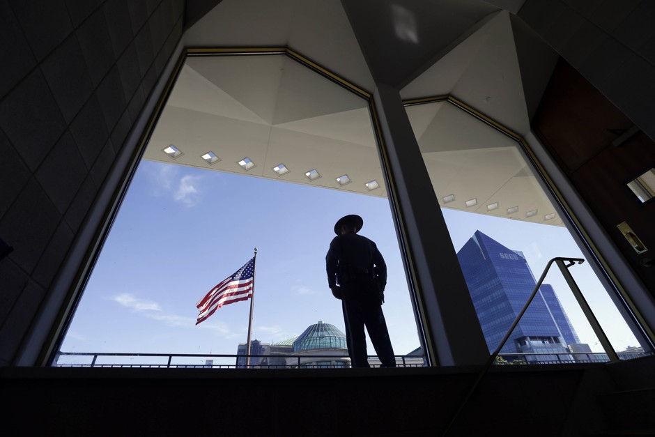 A State Capitol police officer stands watch outside the North Carolina Legislature in Raleigh, N.C.