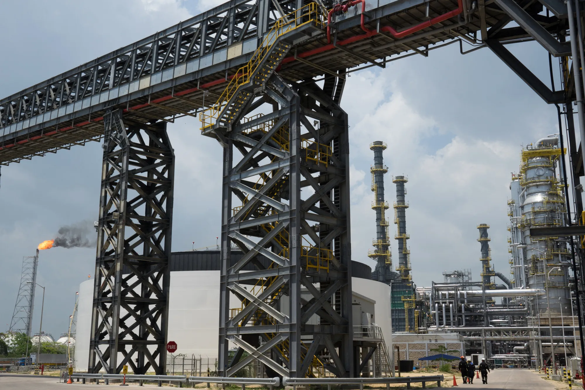 Employees walk through an&nbsp;Ecopetrol refinery in Cartagena, Colombia.