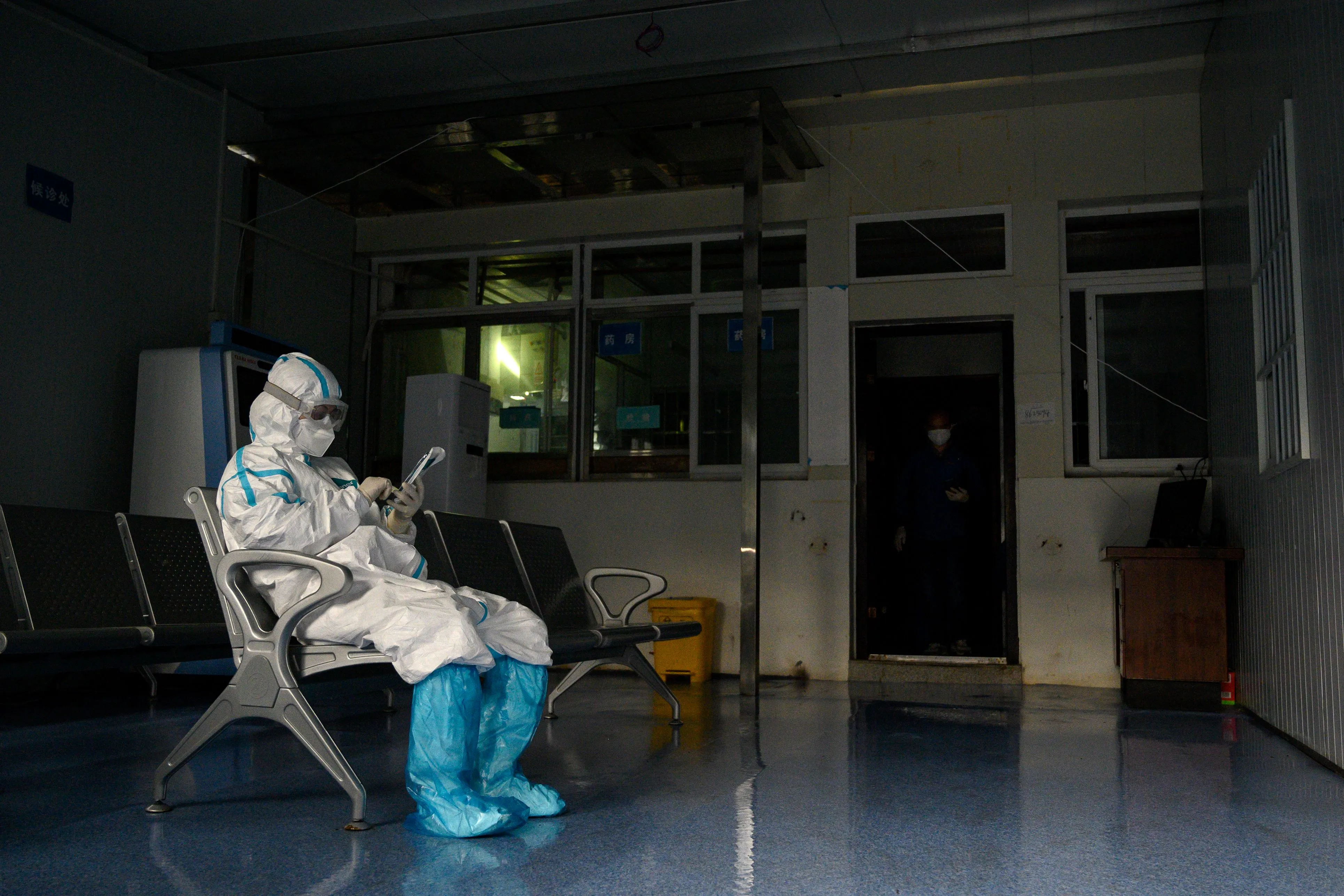 A medical worker takes a rest at a fever clinic in Huanggang Zhongxin Hospital in Hubei province on March 26.