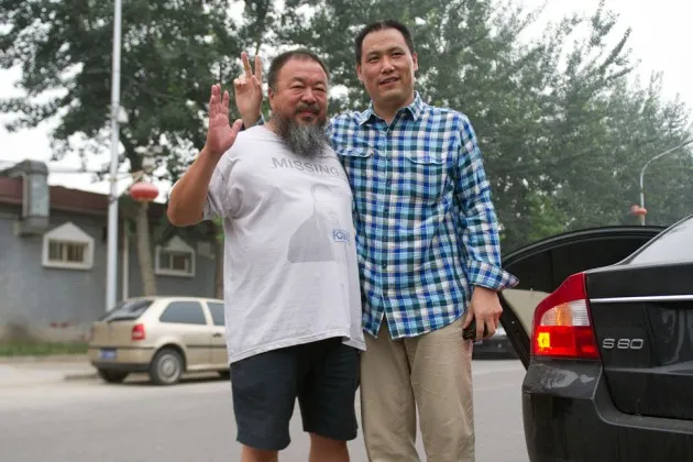 Lawyer Pu Zhiqiang, right, with artist Ai Weiwei, in Beijing on July 20, 2012