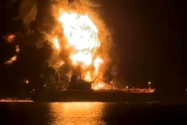 Fire on an oil tanker after it was hit in Iraqi waters, in an image released on March 12.