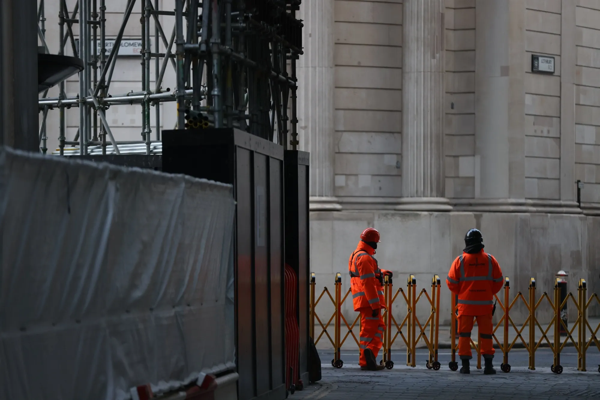 Construction workers on a site in the City of London, UK, on Tuesday, Feb. 14, 2023. UK wages rose quicker than expected at the end of 2022, heaping pressure on the Bank of England to deliver another interest-rate increase next month.