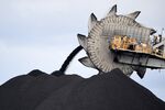 A bucket-wheel dumps&nbsp;soil and sand removed from part of the coal&nbsp;mine in Newcastle,&nbsp;Australia.