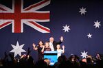 Scott Morrison, Australia's prime minister, second right, waves with his wife Jenny Morrison, left, and their daughters Abigail, second left, and Lily on stage during the Liberal-National coalition party election night event in Sydney, Australia, on&nbsp;May 18.