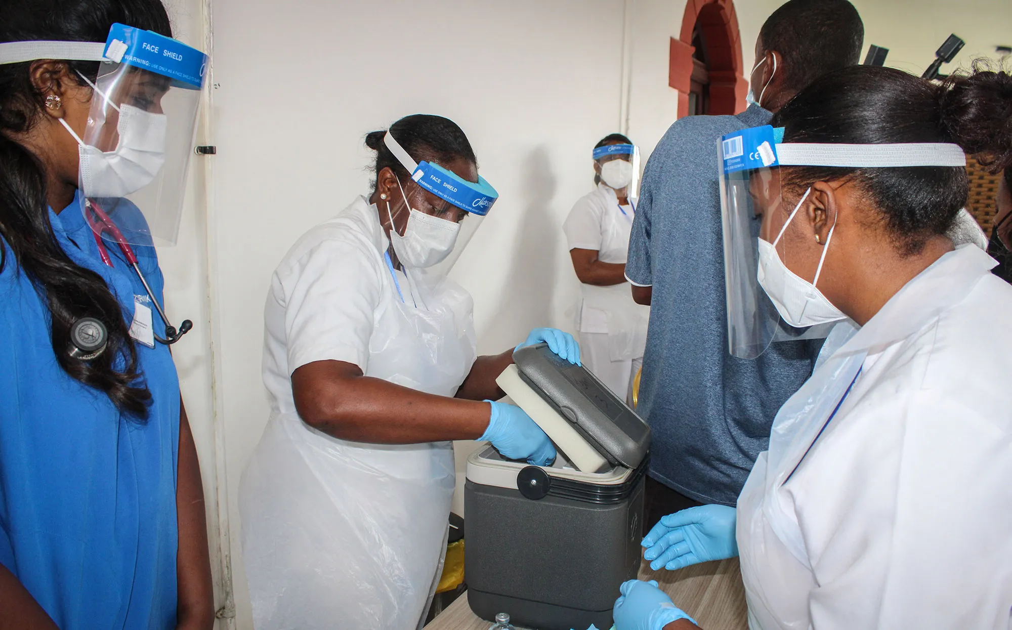 A medical worker unpacks a vaccine at the Seychelles Hospital in Victoria.