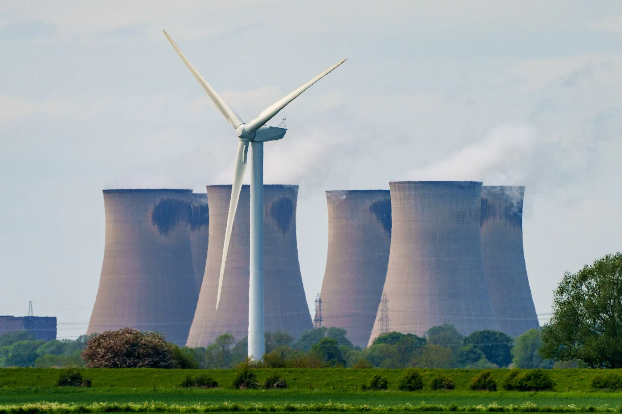 A wind turbine near the Drax Group Plc power station in the UK. Britain’s new Labour government is aiming for a fossil-free energy&nbsp;system within four years.