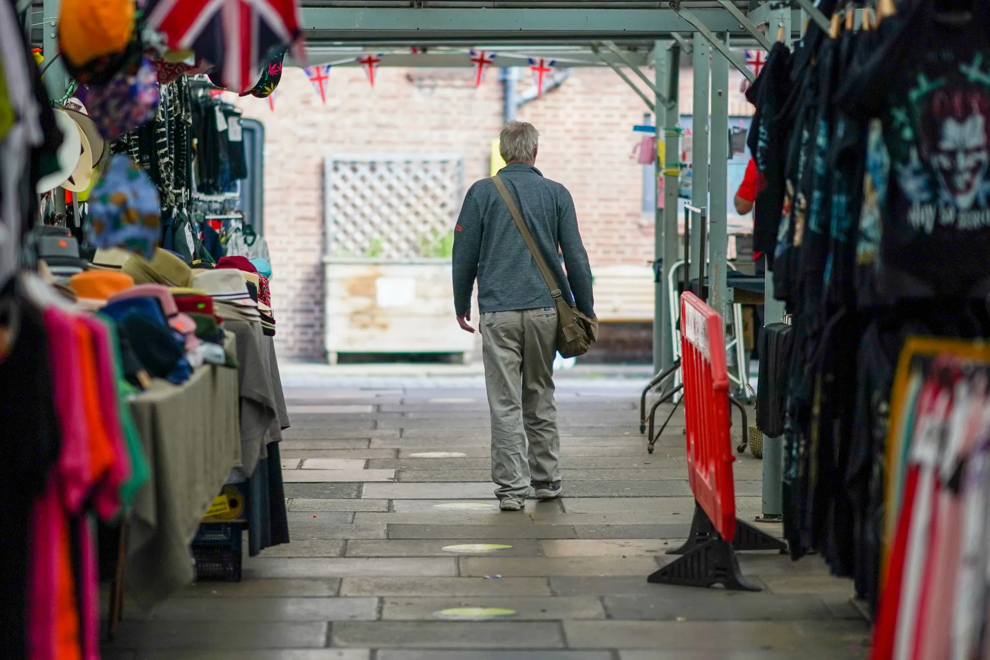 A shopper&nbsp;browses the stalls in the Shambles Market in York, UK.