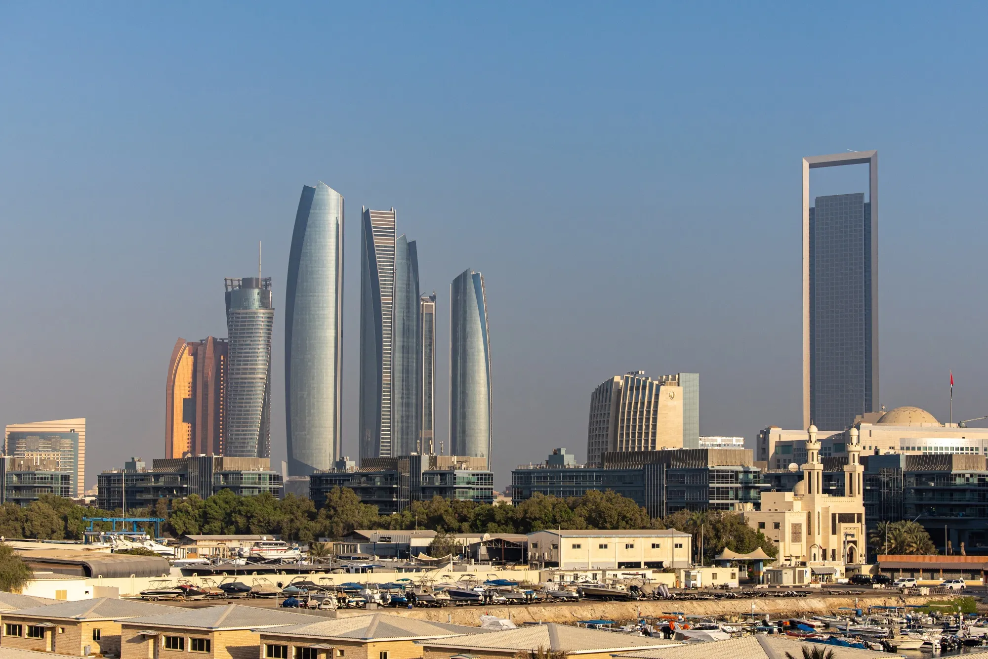 The Etihad Towers, left, and the headquarters of the Abu Dhabi National Oil Co., right.