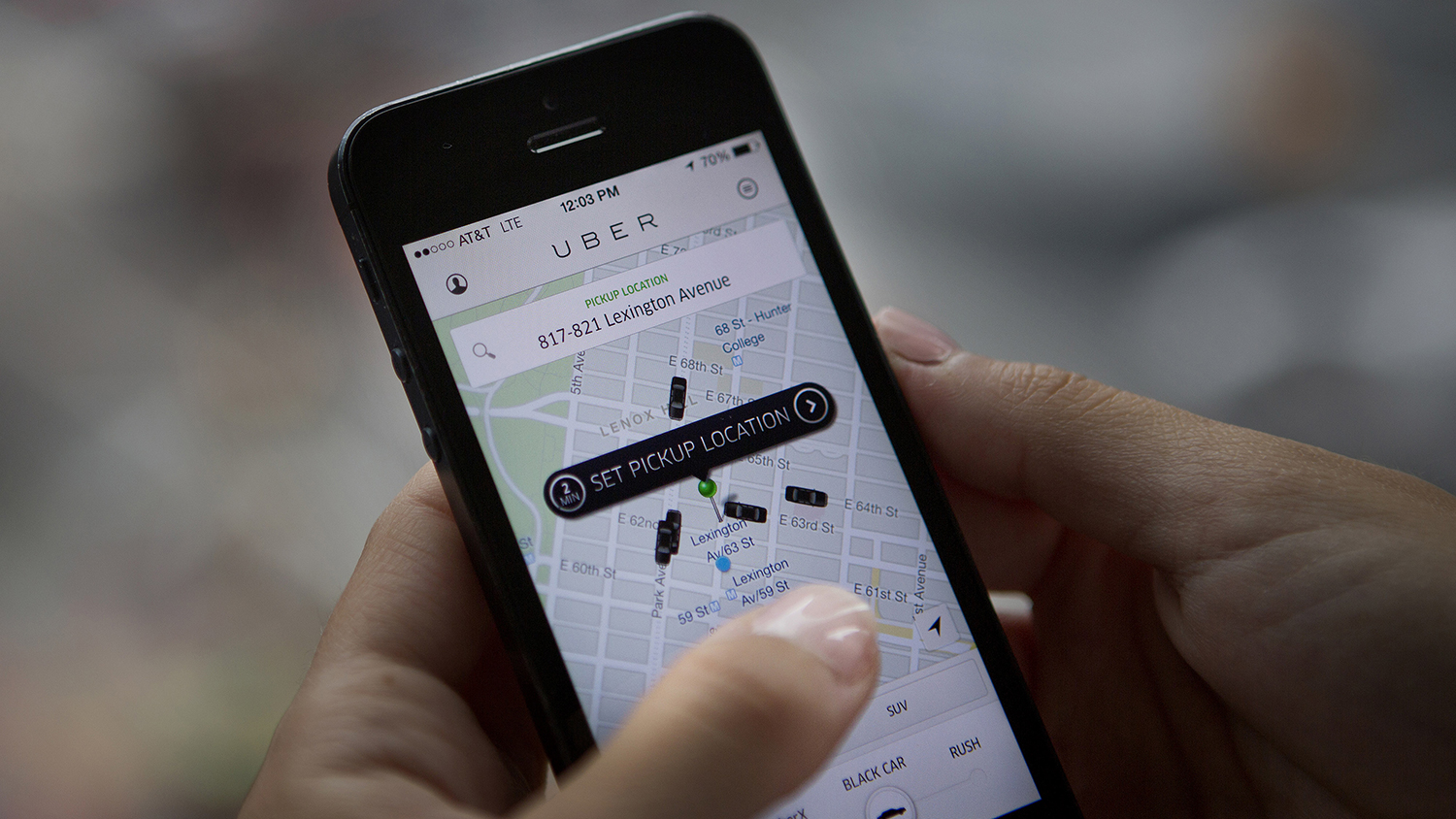 Th Uber Technologies Inc. car service application (app) is demonstrated for a photograph on an Apple Inc. iPhone in New York, U.S., on Wednesday, Aug. 6, 2014.
