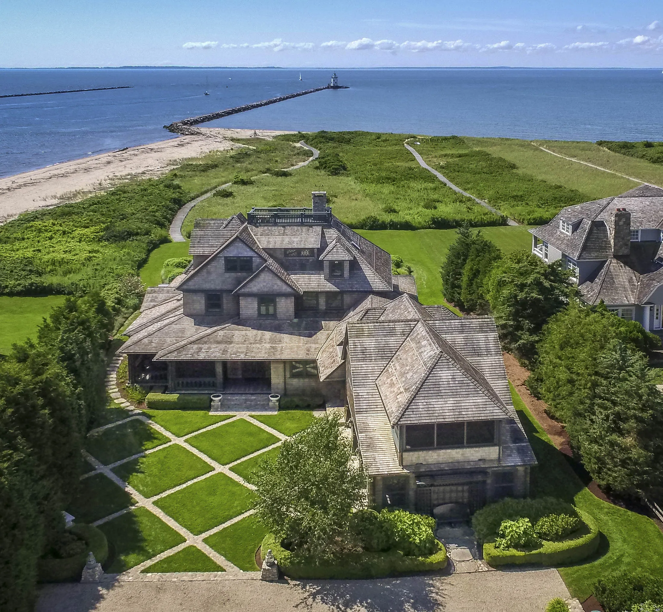 Part of the $10.4 million compound, with the Saybrook Breakwater Lighthouse in the background.