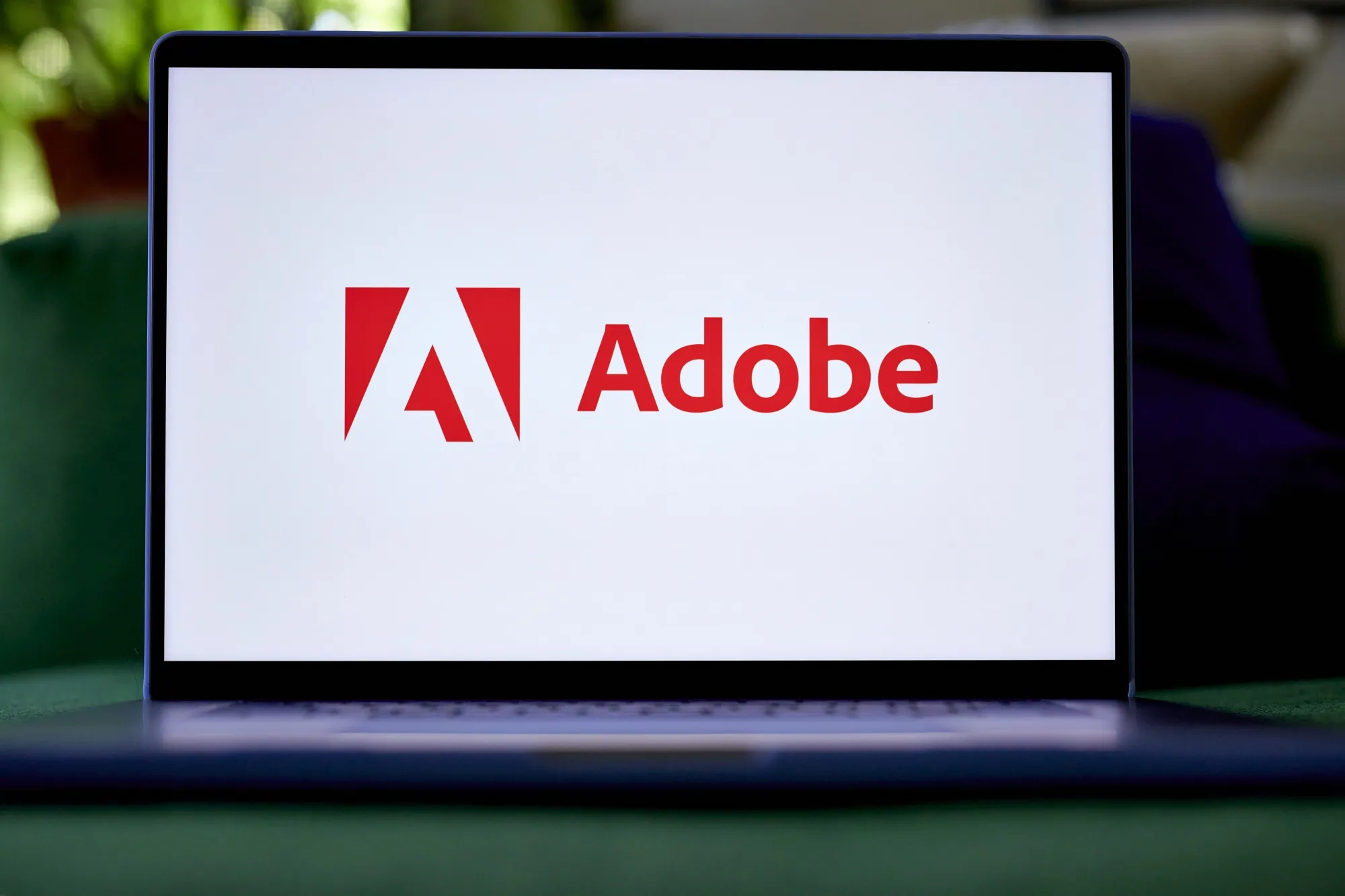 The Adobe logo on a laptop.