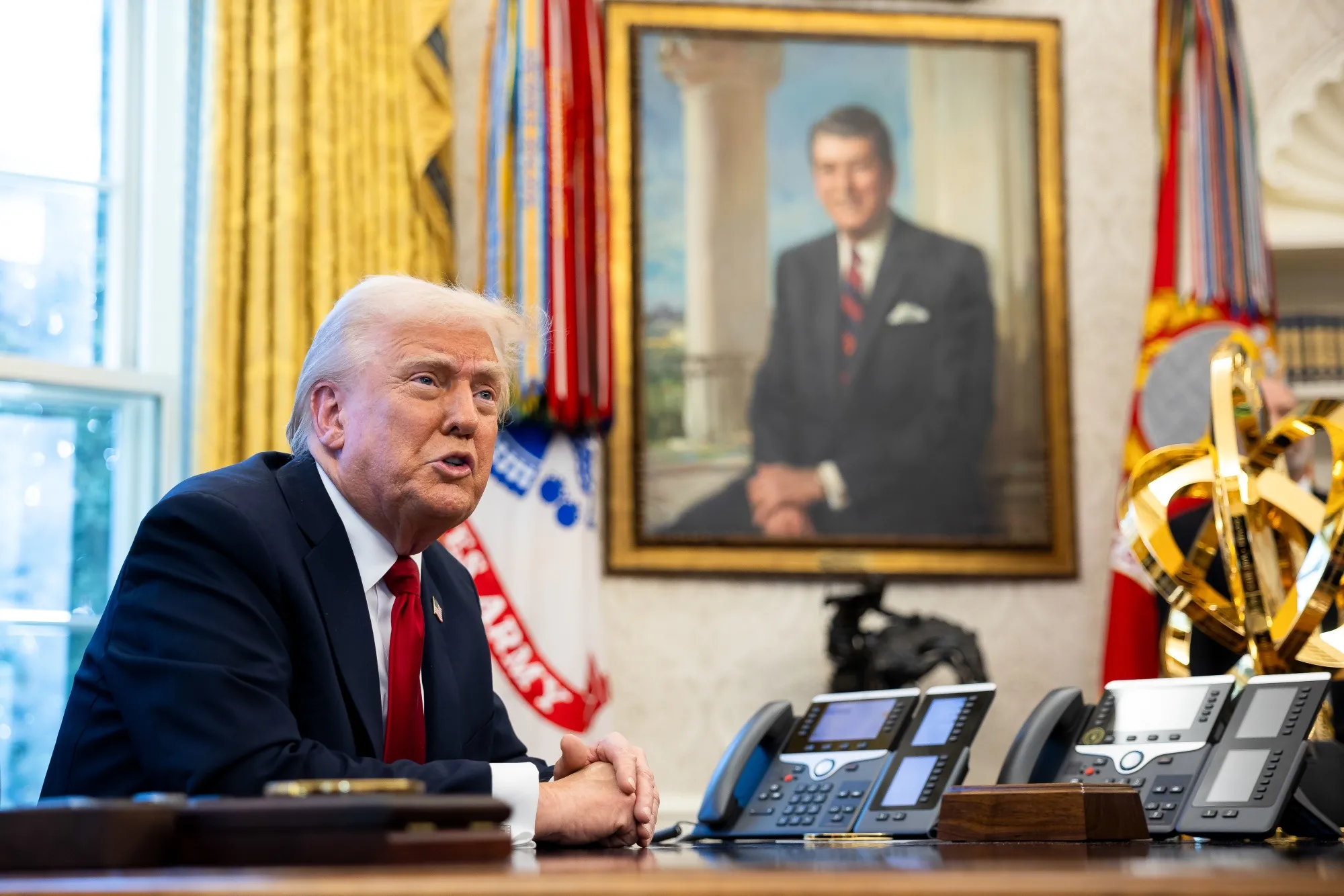 Donald Trump announces tariffs on auto imports in the Oval Office of the White House on March 26.