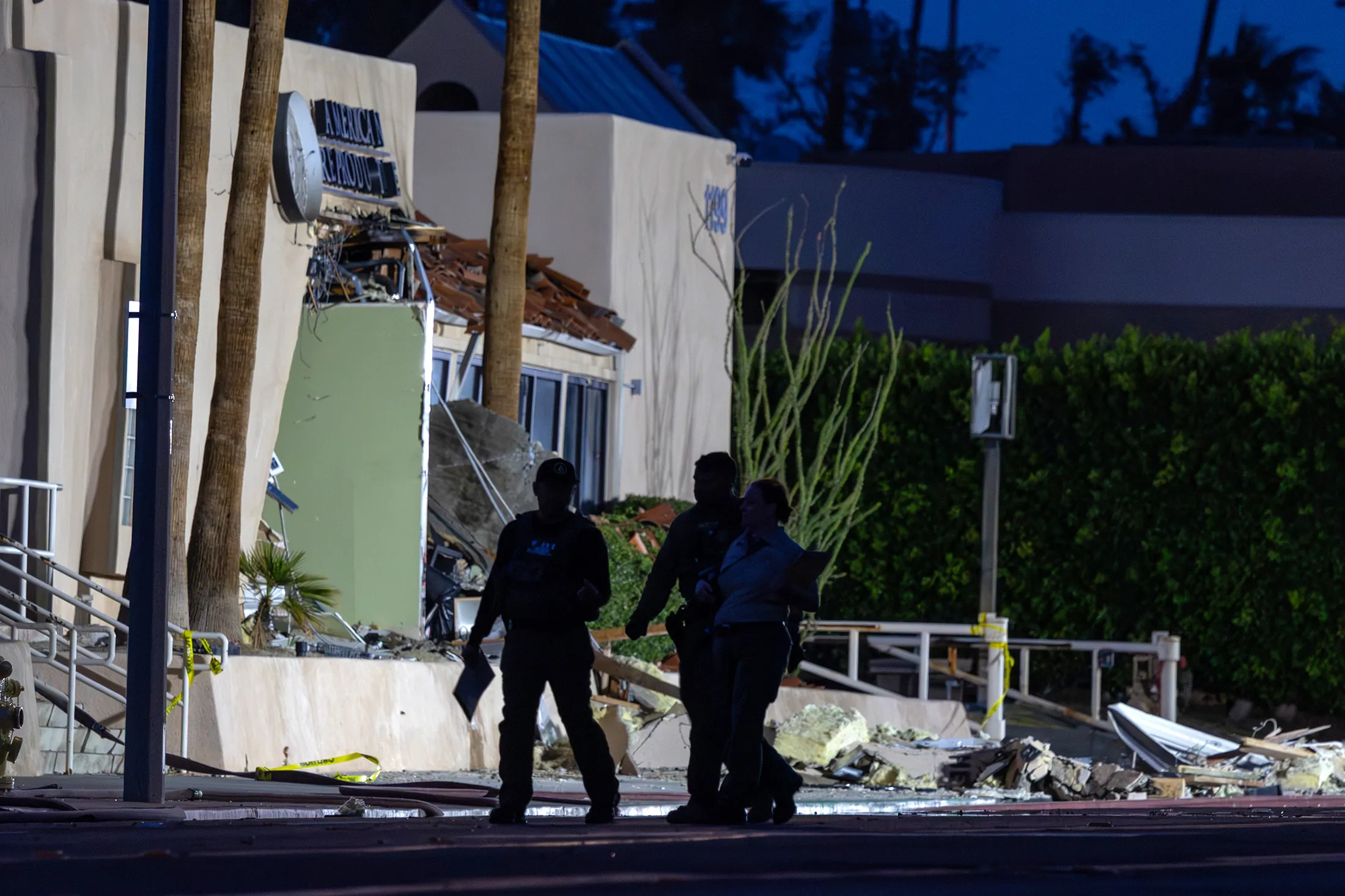 Investigators document the scene at the front of the American Reproductive Centers fertility clinic following a bomb blast in Palm Springs, California, on May 17.