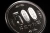 A Japanese 500 yen coin is arranged for a photograph in Tokyo, Japan, on Tuesday, June 20, 2017. Japan’s Cabinet Office will release its monthly economic report on June 22.