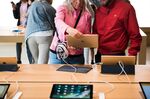 Customers test out an Apple&nbsp;iPad&nbsp;at a store&nbsp;in&nbsp;Brooklyn, New York.