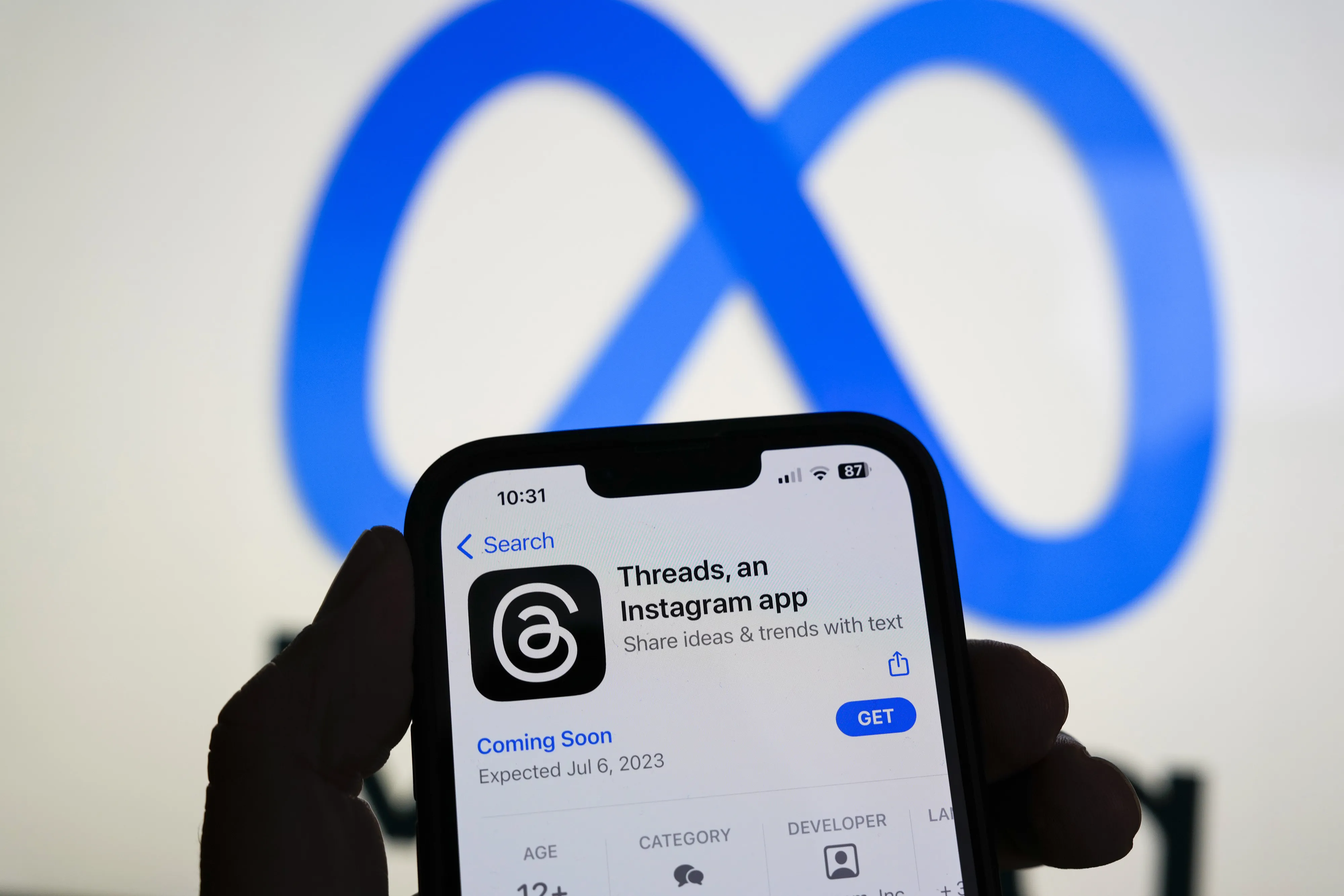 The Threads app, operated by Meta Platforms Inc., on a smartphone, besides a Meta logo, arranged in Madrid, Spain, on&nbsp;July 5, 2023.&nbsp;