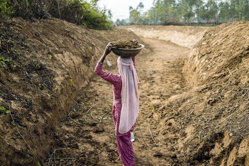A laborer works on the Saraswati canal in Yamuna Nagar