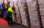 A worker prepares pallets of food at a refrigerated warehouse in Peterborough, U.K.