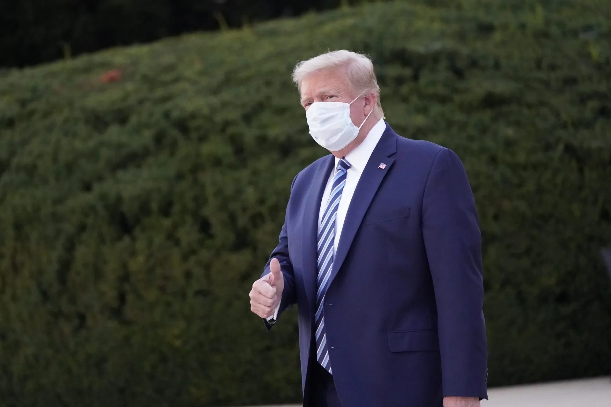 U.S. President Donald Trump gestures outside of Walter Reed National Military Medical Center in Bethesda, Oct. 5.
