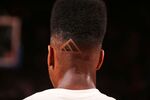 Iman Shumpert of the New York Knicks shows off his haircut before the game against the Milwaukee Bucks on April 5 at Madison Square Garden