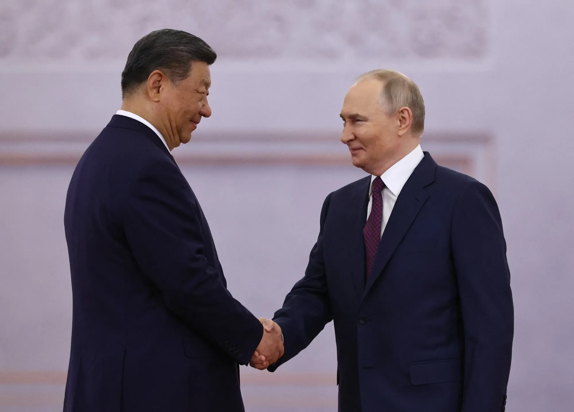 Vladimir Putin, right, and Xi Jinping at the Kremlin last year.