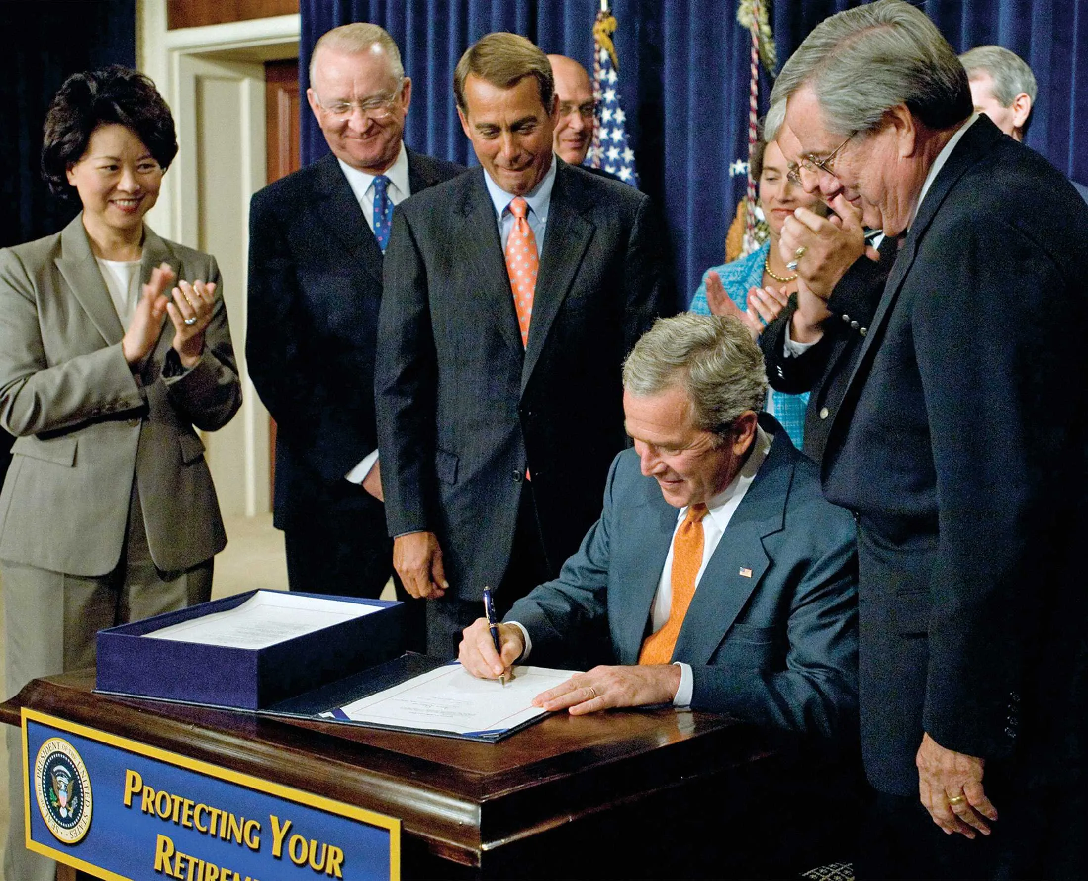 President George W. Bush signs the Pension Protection Act in 2006.