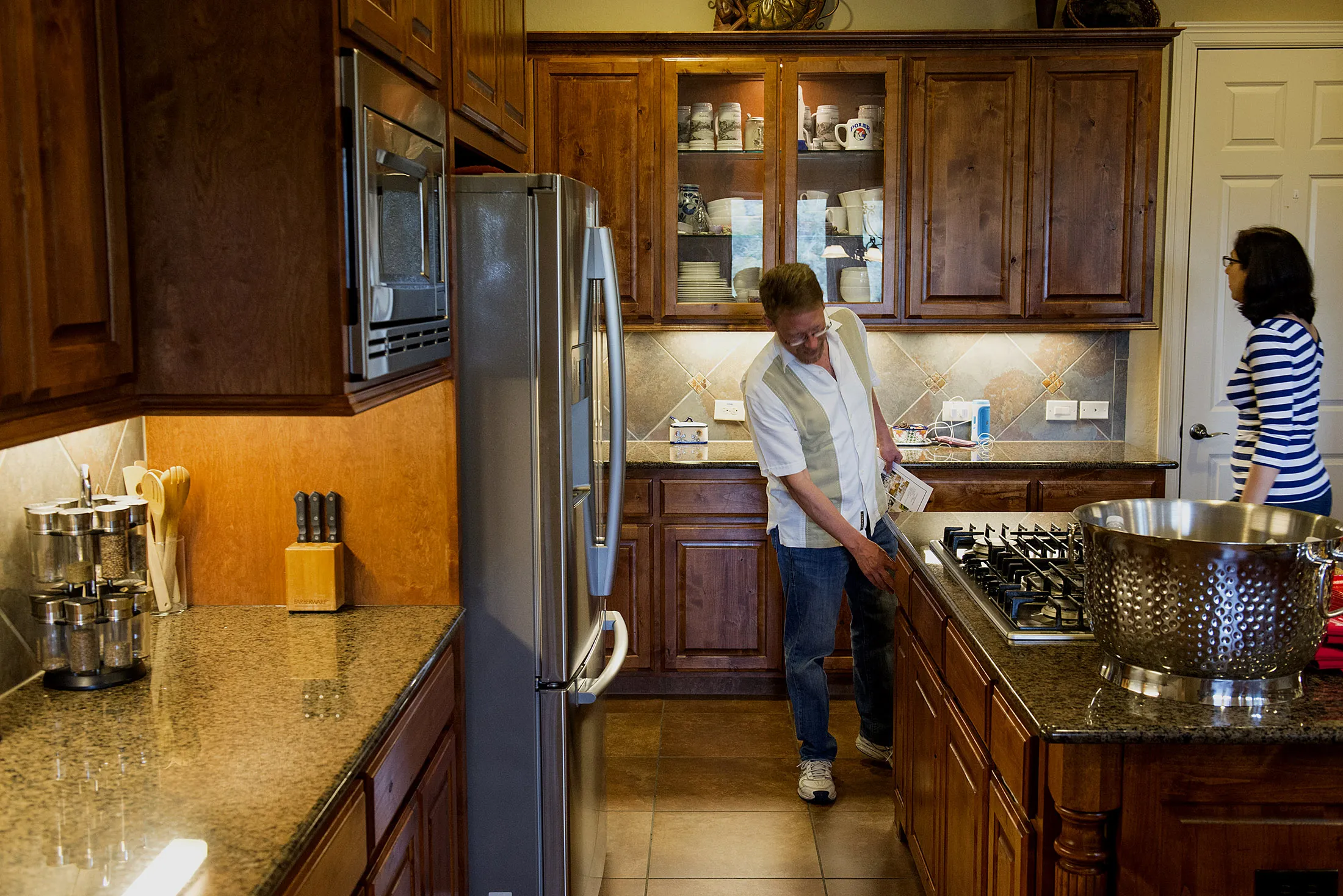 Prospective home buyers view a kitchen while touring a house for sale in Helotes, Texas, U.S., on Sunday, Feb. 21, 2016. The National Association of Realtors is expected to release existing home sales figures on February 23.
