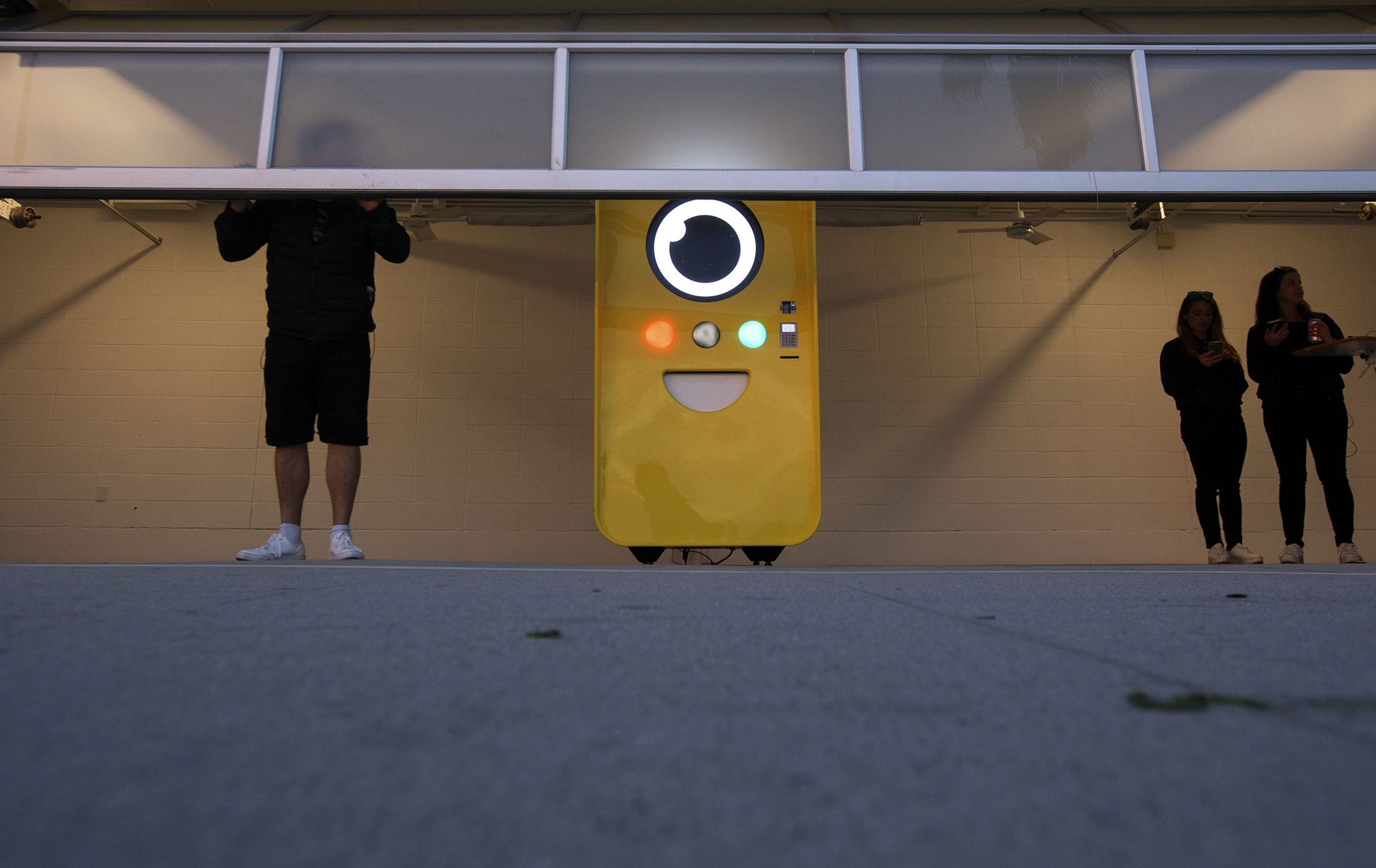An employee closes the Snapchat Spectacles by Snap Inc. vending machine pop-up store after sunset in the Venice neighborhood of Los Angeles, on March 14, 2017.
