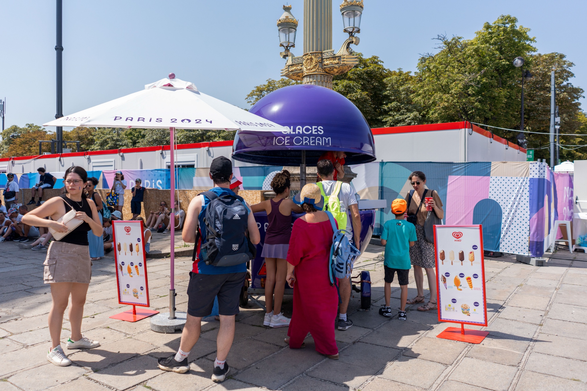 Spectators queue for ice cream at the Paris 2024 Olympic Games Concorde stadium venue in Paris, on July 30.