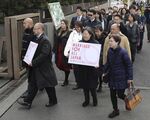 Members of plaintiff demanding same-sex marriage in Japan enter the Tokyo District Court on Feb. 14.