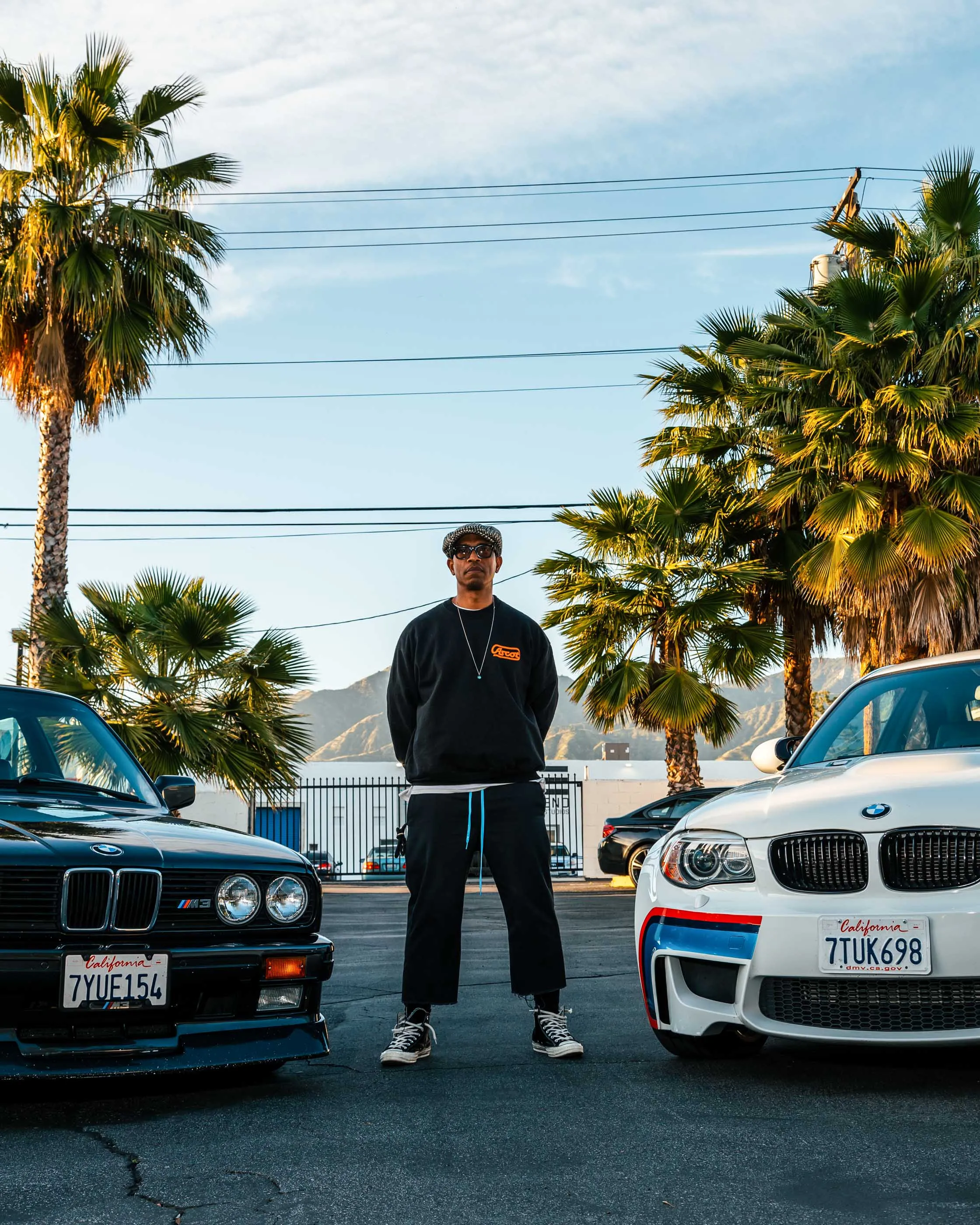 Adrian Miles,&nbsp;marketing director at Jordan Brand, and his two BMWs, a 1990&nbsp;BMW M3 E30 and a 2011 BMW 1M E82, in Glendale, California.