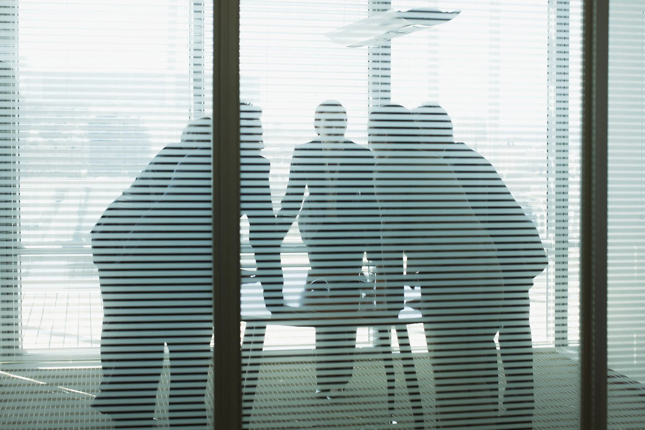 Business people leaning on table in meeting
