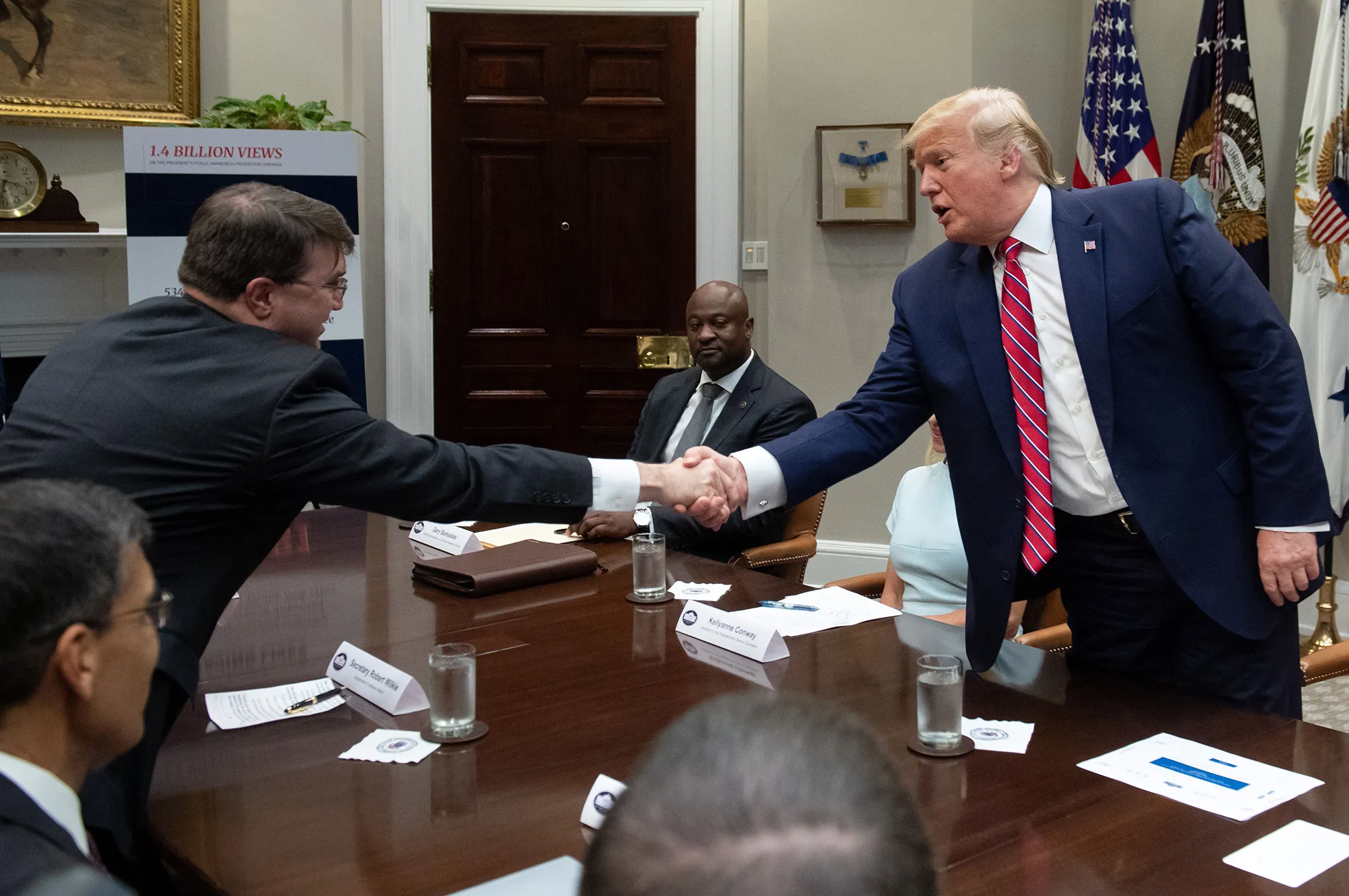President Donald Trump shakes hands with Robert Wilkie, secretary of the Veterans Affairs (VA), during a meeting on the opioid epidemic on&nbsp;June 12, 2019.