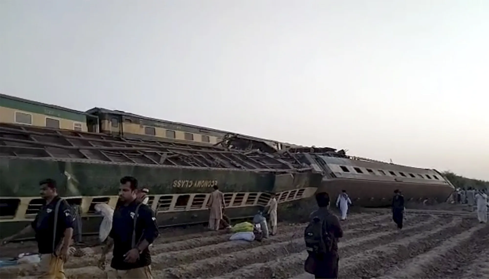 An overturned train after a collision in Ghotki, Pakistan on June 7.