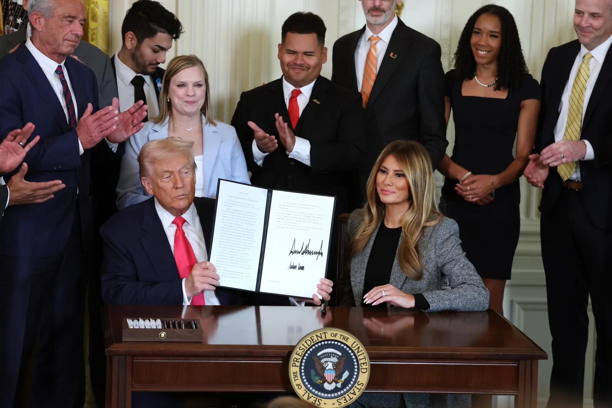 US&nbsp;President Donald Trump and first lady Melania Trump sign the "Fostering the Future" executive order&nbsp;in the East Room of the White House in Washington on Nov. 13.&nbsp;