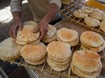 Bread is prepared at a&nbsp;bakery at a market in Cairo.