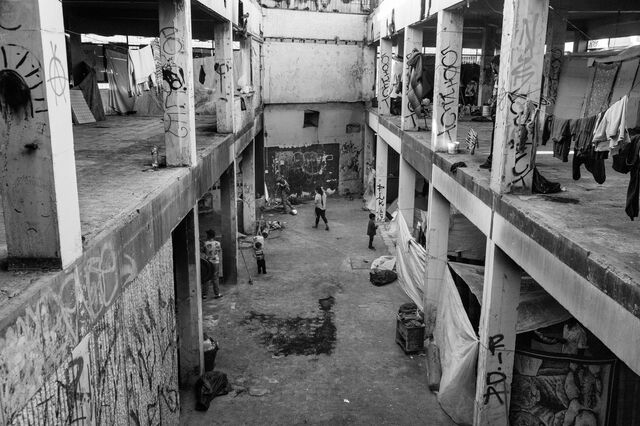 Migrants in an abandon building. 