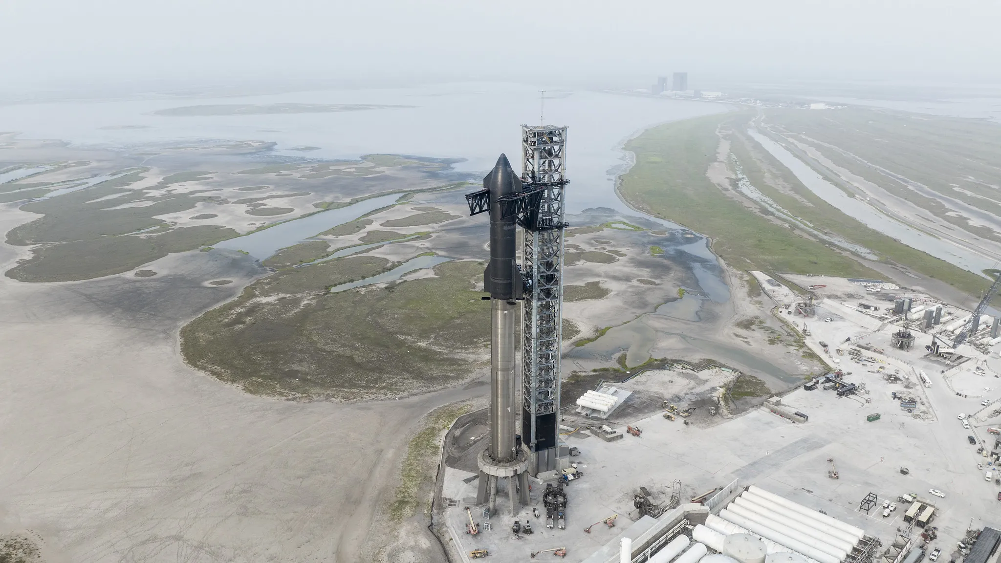 The Starship spacecraft stacked atop the Super Heavy rocket booster at the SpaceX launch site in Texas.