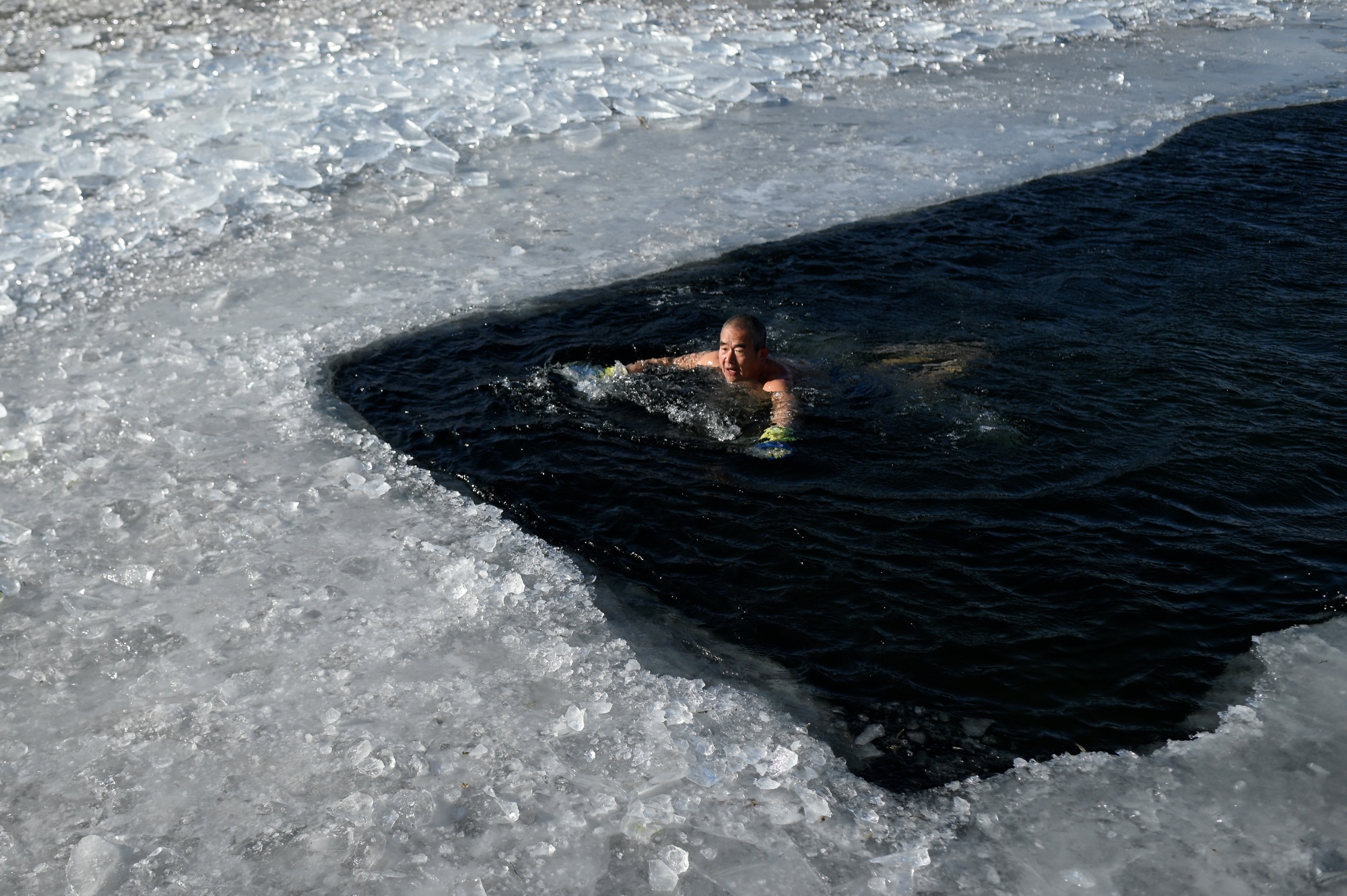 A winter dip: Swimmers prepare to plunge into freezing Otago lake