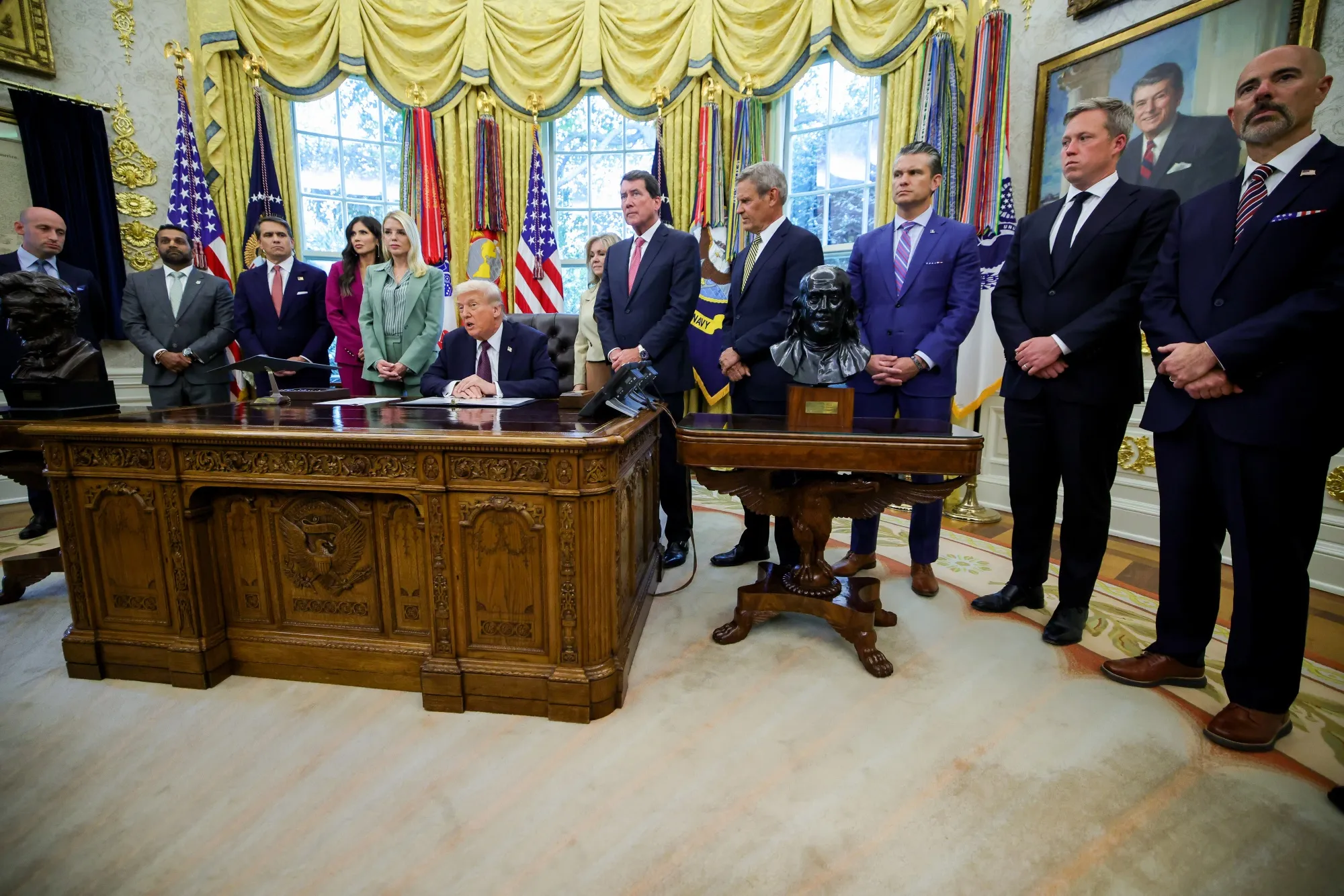 President Donald Trump, center, speaks during a memorandum signing in the Oval Office of the White House in Washington, DC,&nbsp;on&nbsp;Sept. 15.